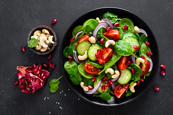 Spinach salad with vegetables and nuts - Stock Photo - Images