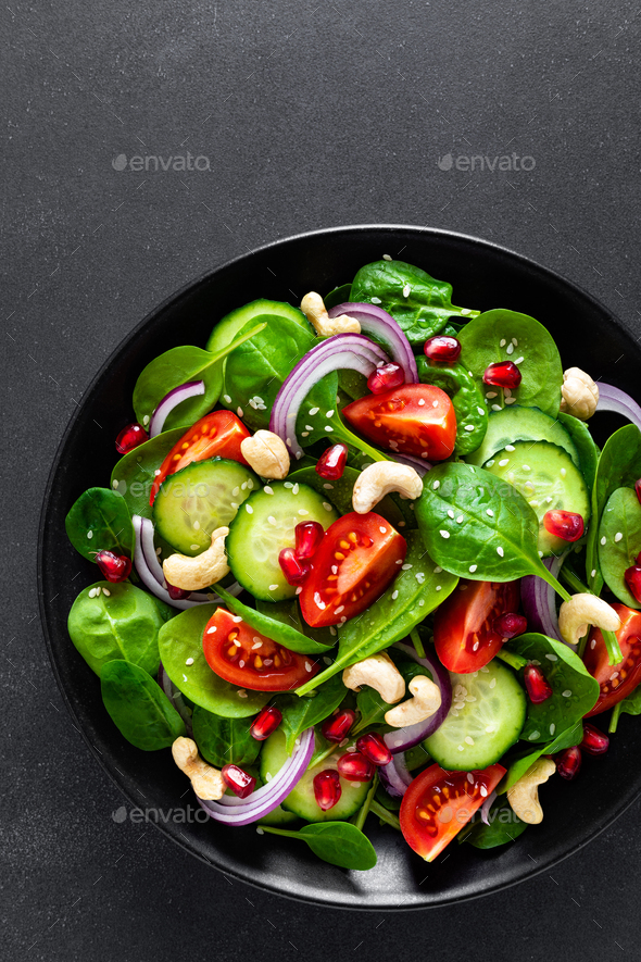 Spinach salad with vegetables and nuts - Stock Photo - Images