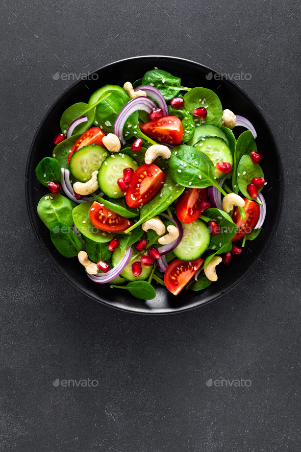 Spinach salad with vegetables and nuts - Stock Photo - Images