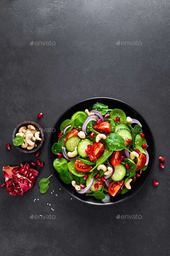 Spinach salad with vegetables and nuts - Stock Photo - Images
