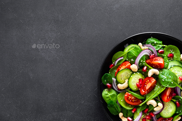 Spinach salad with vegetables and nuts - Stock Photo - Images