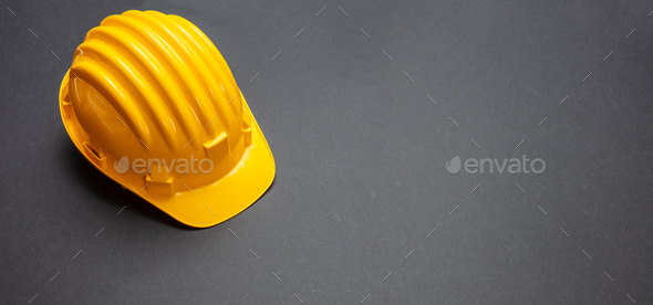 Download Construction project safety, Yellow hard hat on black ...