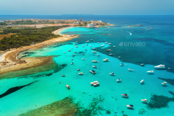 Boats and luxury yachts in transparent sea at sunset in summer - Stock Photo - Images