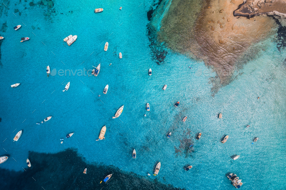 Aerial view of boats and luxury yachts in transparent blue sea - Stock Photo - Images