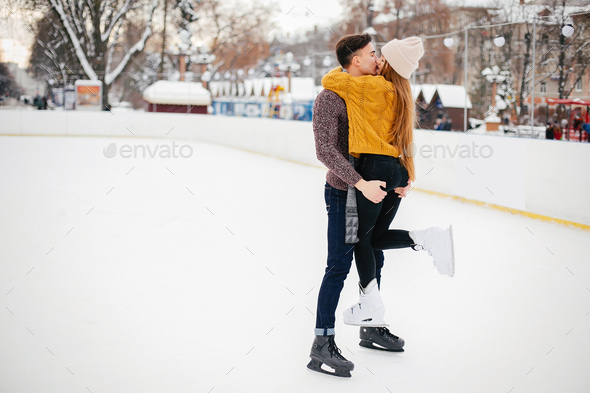 Cute couple in a ice arena - Stock Photo - Images