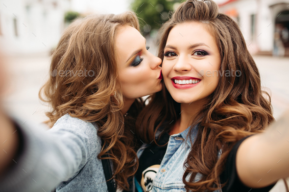 Pretty Teen Girls With Hairstyles And Red Lips Smiling At Camera