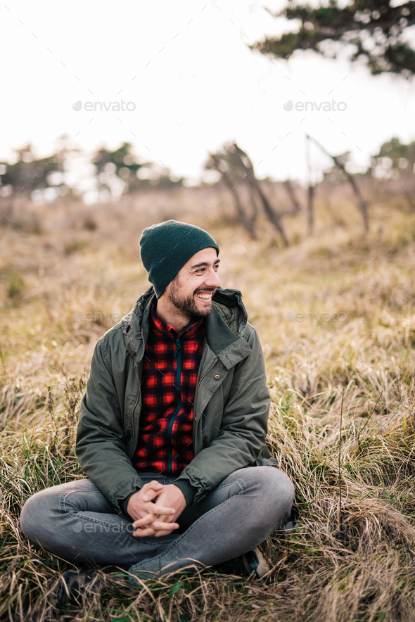 Man sitting on a grass in nature Stock Photo by viki2win | PhotoDune