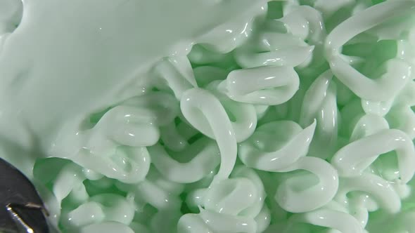 Motion of the Liquid Cream Green Cosmetic Texture with Rotation alt