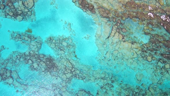 Aerial footage of beautiful coral reefs in turquoise color water