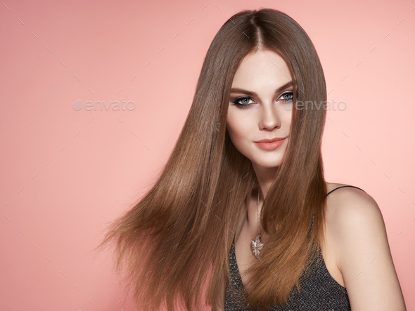 Brown-haired woman with long smooth hair - Stock Photo - Images
