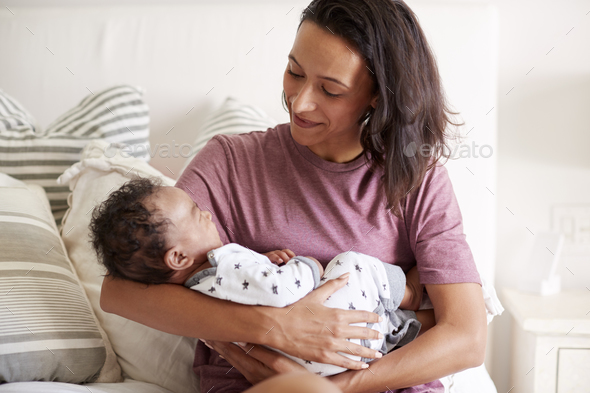 baby holding bed