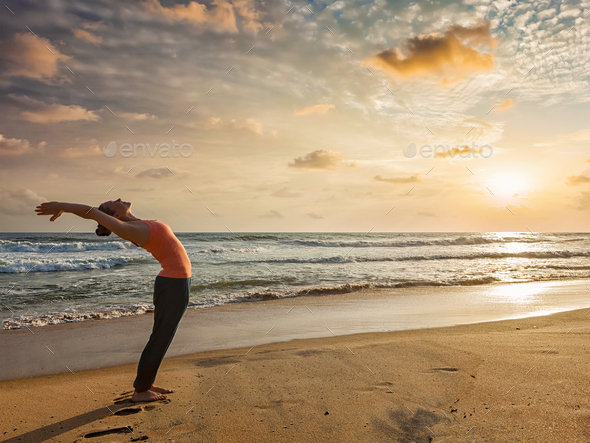 Woman doing yoga Sun salutation Surya Namaskar