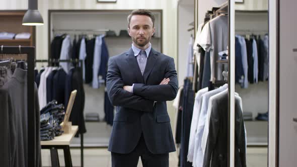 A Front View Slow Motion Video Concept of a Dark Haired Man Dressed in a Business Clothes and