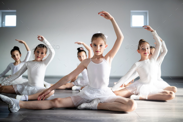 little ballerinas girls doing exercises 