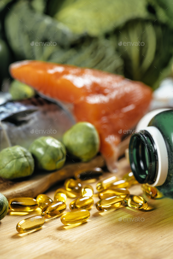 Omega 3 Gel Capsules and Natural Sources of Omega 3 Stock Photo by microgen