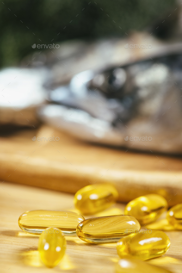 Omega 3 Gel Capsules and Natural Sources of Omega 3 Stock Photo by microgen
