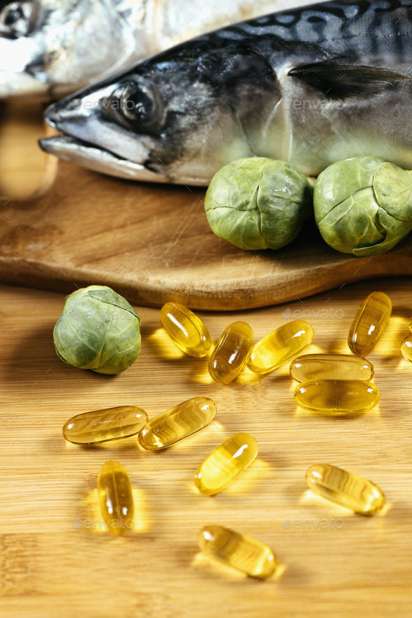 Omega 3 Gel Capsules and Natural Sources of Omega 3 Stock Photo by microgen