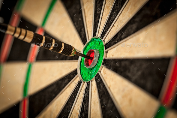 Dart in bull&#39;s eye close up - Stock Photo - Images
