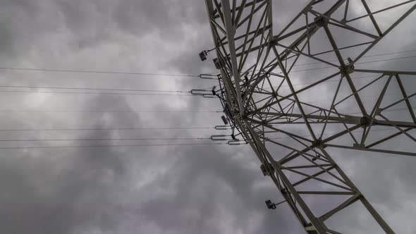 Time Lapse View of Clouds Hovering Over an Electrical Tower