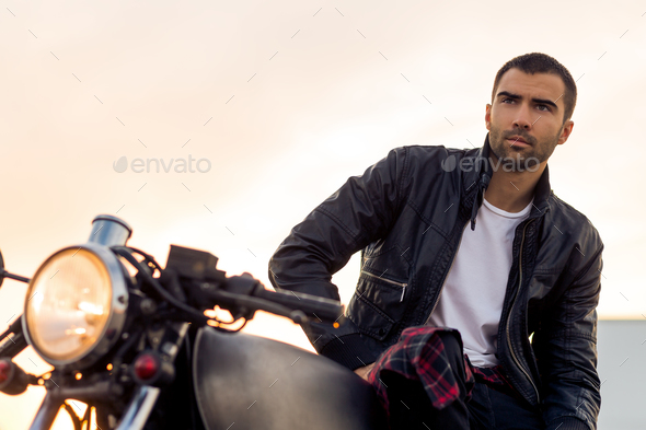 Brutal man sit on cafe racer custom motorbike. - Stock Photo - Images