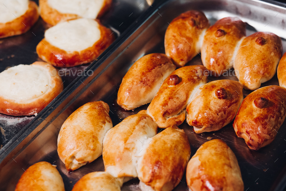 Delicious fresh baked flavored buns set made of sweet dough - Stock Photo - Images