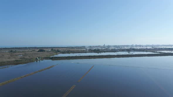 Beautiful Aerial Drone View of Rows Agricultural Field Farmland and Water Irrigation Submerged in alt