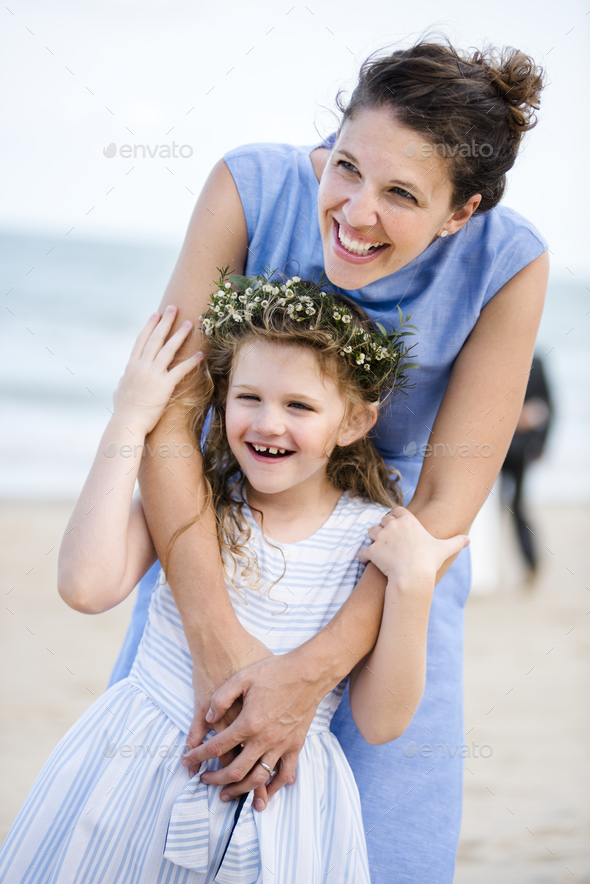 Mother and daughter at beach wedding