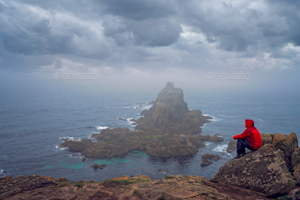 Tourist admiring landscape of Lands End - Stock Photo - Images