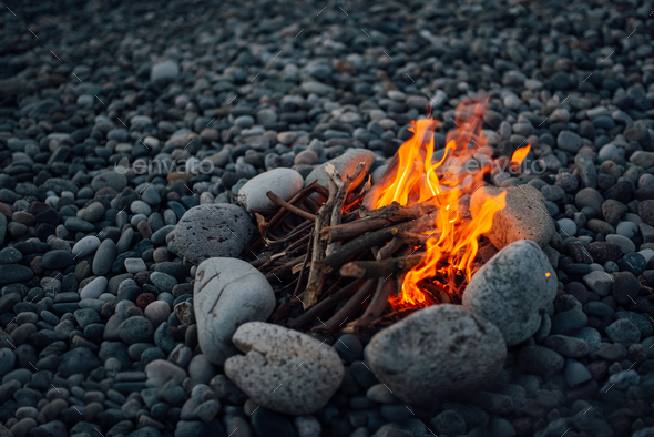 fire overlaid with stones burning