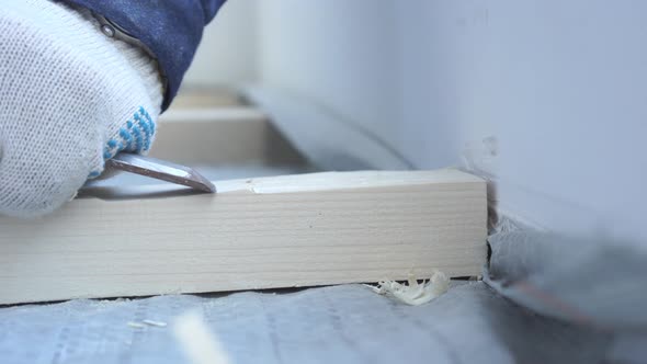 Master Carpenter Mounts Pine Wood Floor - Eco-friendly Flooring. Screwing Lag To Concrete