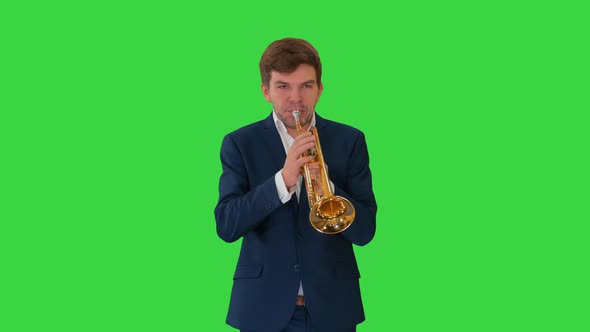 Young Man in Suit Playing a Trumpet While Walking on a Green Screen, Chroma Key alt