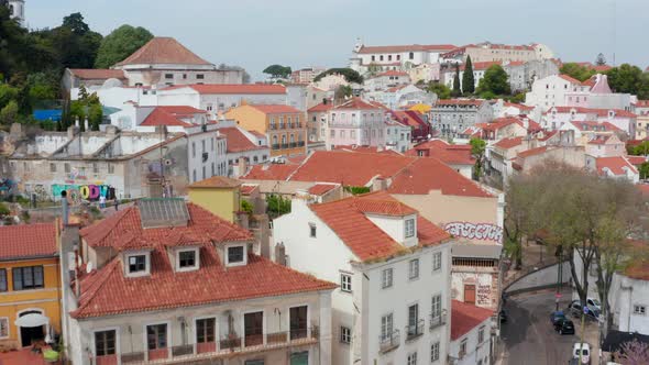 Low Aerial Dolly in Aerial View of Colorful Traditional Houses and Homes with Red Rooftops in alt