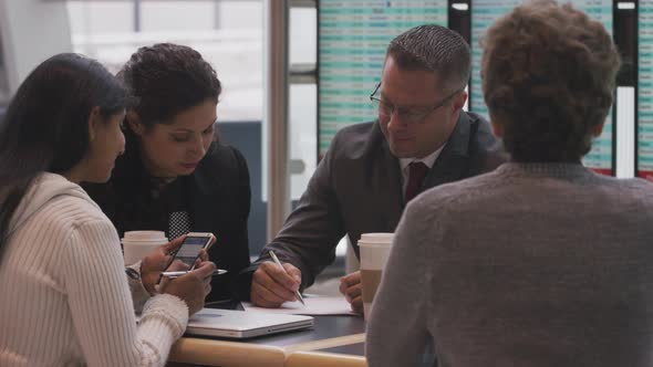 Group of businesspeople meeting at airport