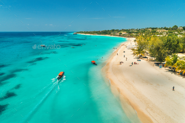 Aerial view of boats on tropical sea coast with sandy beach - Stock Photo - Images