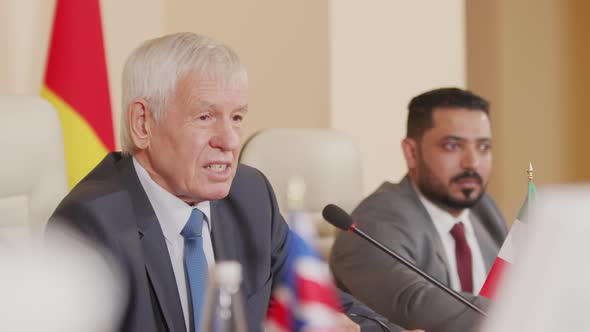 Multiethnic Politicians Having Discussion at Press Conference alt