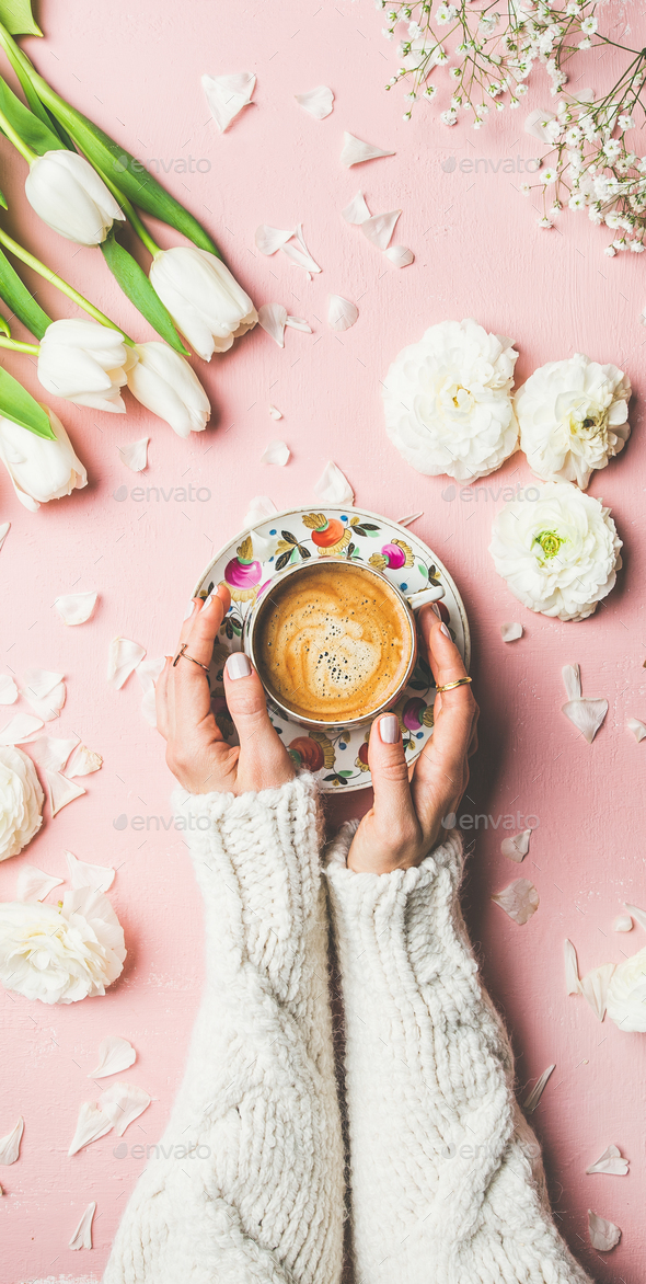 Spring layout with Coffee in female hands and white flowers - Stock Photo - Images