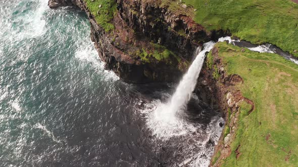 Stunning Waterfall Splashing From Cliff Aerial View