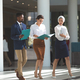 Front view of diverse business people walking with files in their hands in lobby - $5.00 Front view of diverse business people walking with files in their hands in lobby