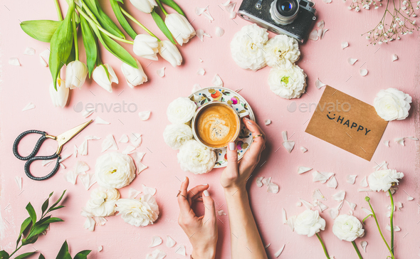 Coffee in female hands, flowers, film camera and sign happy - Stock Photo - Images