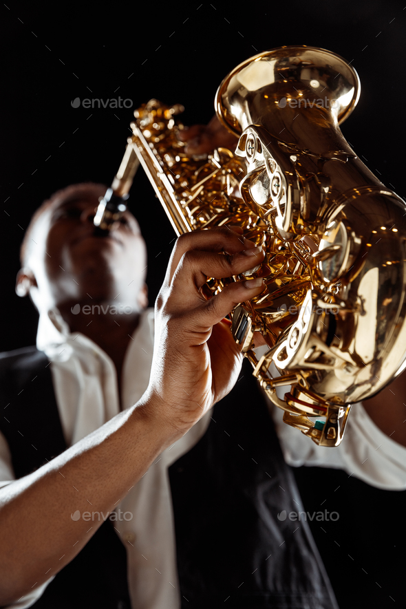 African American jazz musician playing the saxophone. - Stock Photo - Images