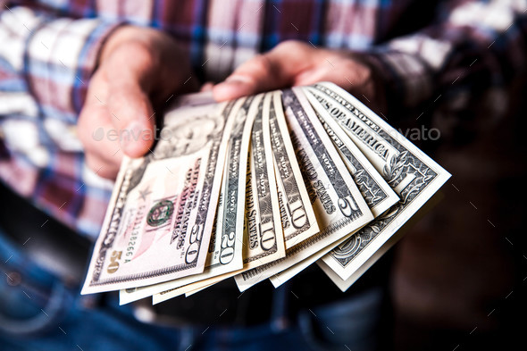 dollars in the hands - Stock Photo - Images