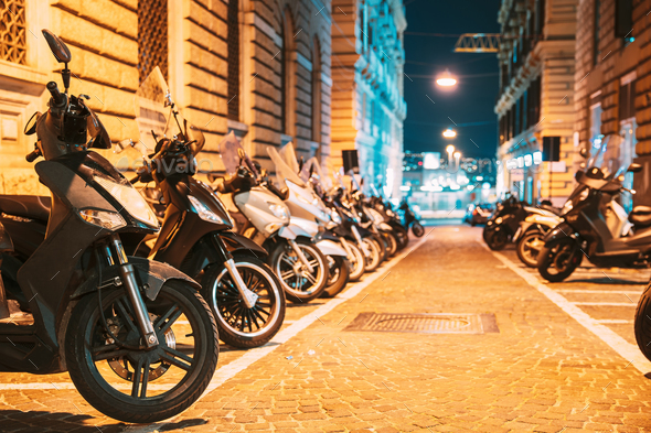 Many Motorbikes, Motorcycles Parked In City. Scooters Parked On - Stock Photo - Images