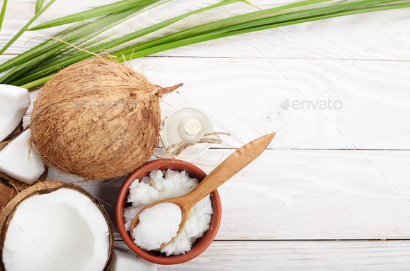 Flat lay Background of coconut, coconut shell, oil in clay bowl - Stock Photo - Images