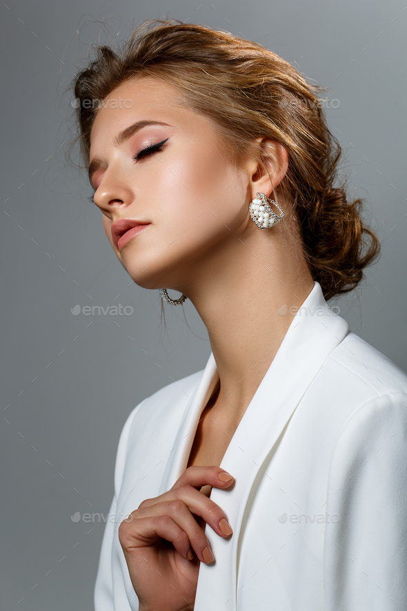 beautiful dark blonde girl in white jacket - Stock Photo - Images