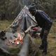 Adventurer Making Campfire by the Tent While Forest Camping - VideoHive Item for Sale