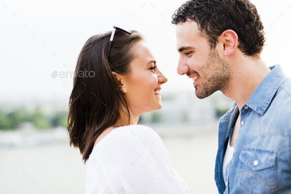 Young beautiful couple rubbing noses as a sign of love