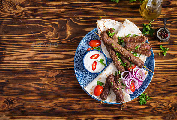 Kebab adana, chicken, lamb and beef on lavash bread