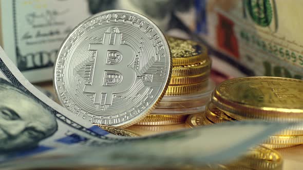 Close up crypto coins with silver bitcoin and dollars