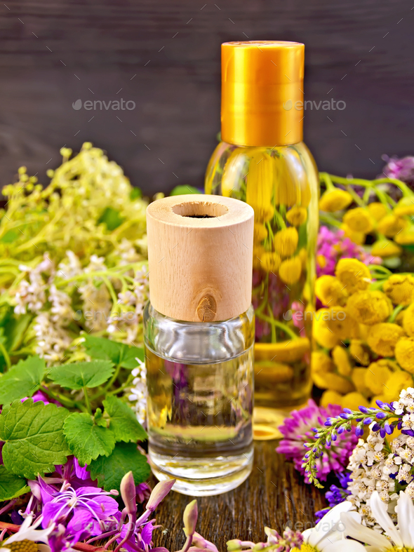 Oil and lotion with flowers on board - Stock Photo - Images