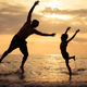 Father and son playing on the beach at the sunset time. - PhotoDune Item for Sale